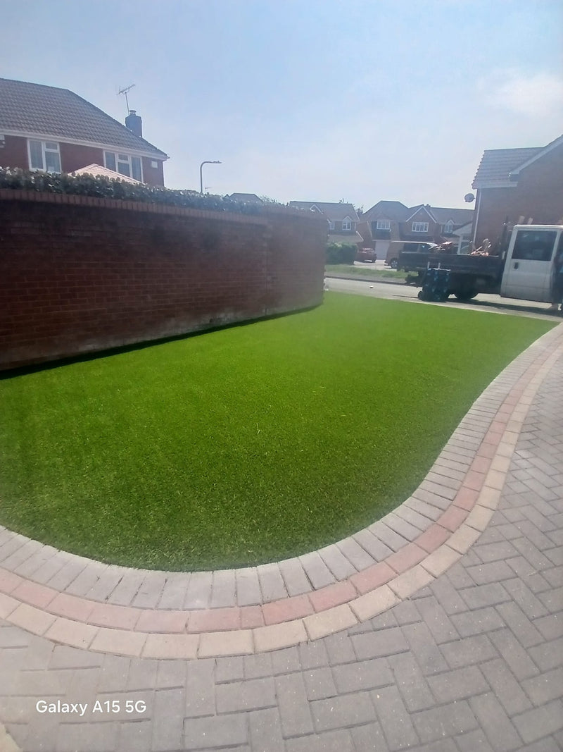 Artificial grass installed on a front lawn at Honeysuckle Drive in Featherstone, WV10 7TD